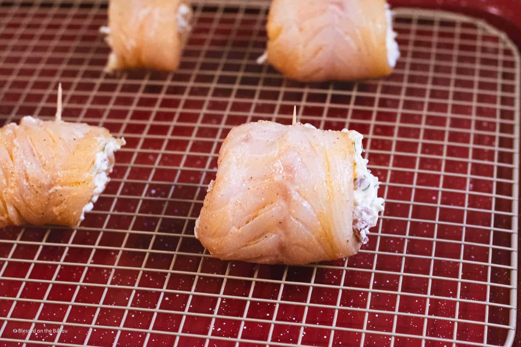 rolled fish with stuffing secured with toothpick