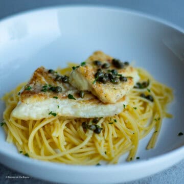 Grouper Picatta plated, capers pasta, lemon white wine sauce