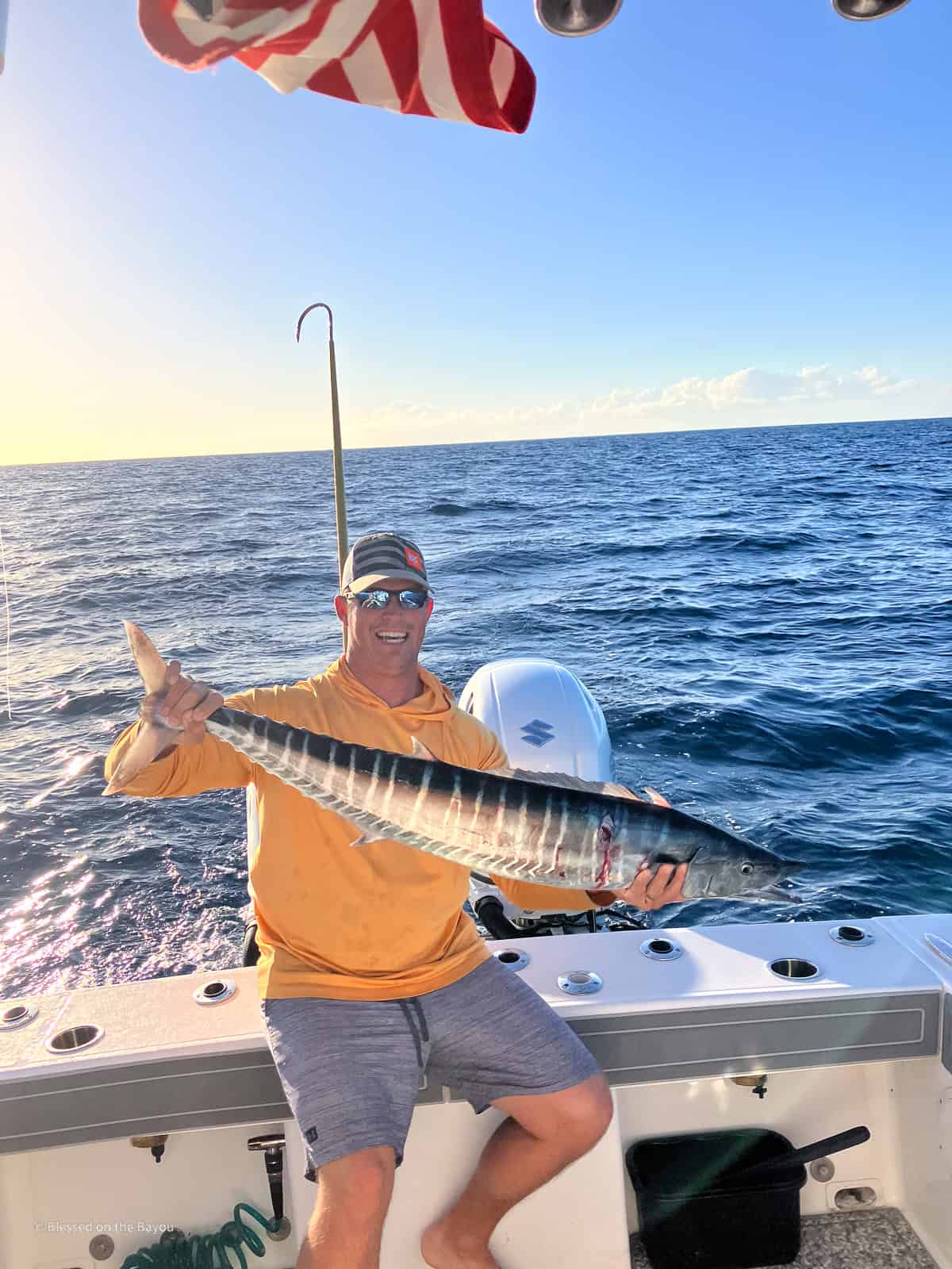 Man Holding Just Caught Wahoo Fish