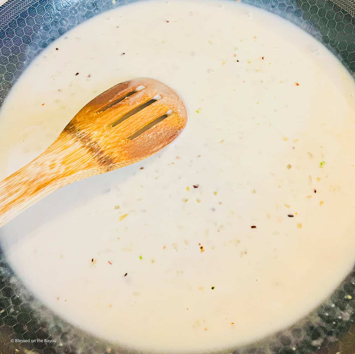 coconut lime sauce cooking in hexclad cookware