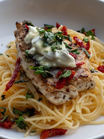 Grouper Grazia grouper over noodles with goat cheese sundried tomatoes and basil